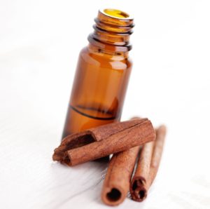 bottle of cinnamon aromatherapy oil - beauty treatment